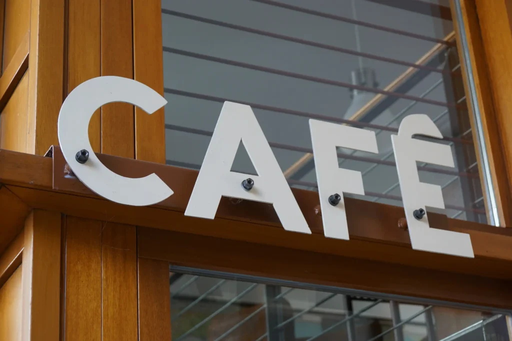 closeup cafe sign fixed wooden beam shop Horizontal